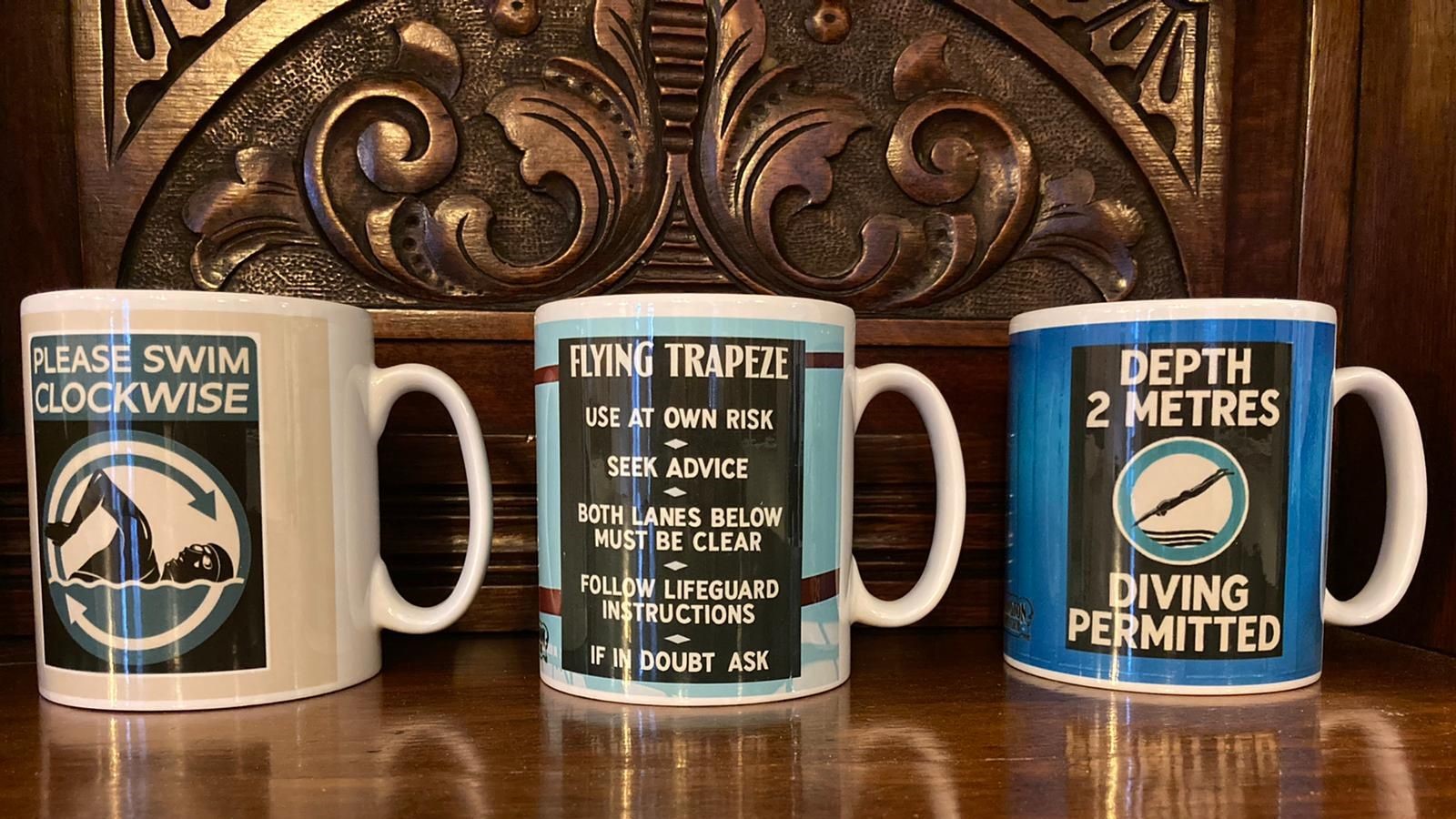 mugs decorated with swimming bath signage
